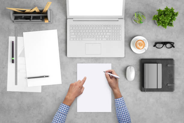 istock Architect designer writing on a blank piece of paper, copy space template - top view 994842348