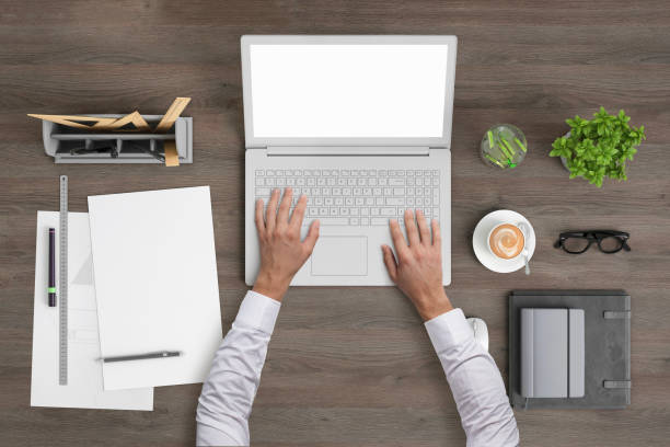 istock Architect working on a laptop knolling overhead view 994842374
