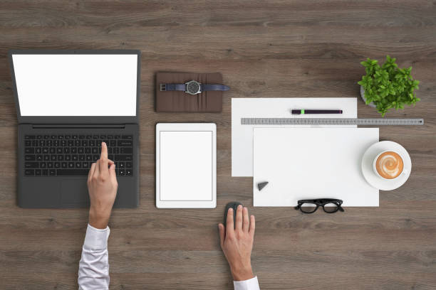 istock Man working on a laptop knolling overhead view 994842410