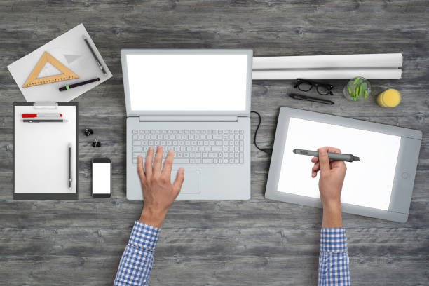 istock Architect designer working on office desk knolling overhead view 994842444