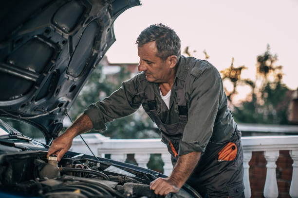 istock Mechanic repairing car 994842652