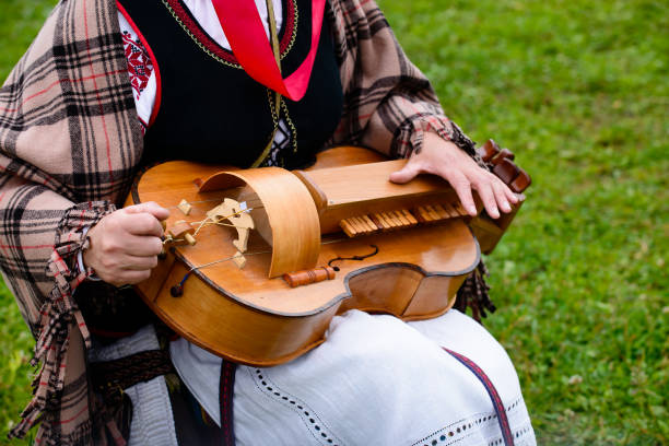 istock close-up of female hands playing lute 994844542