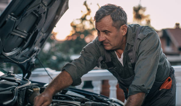 istock Mechanic repairing car 994844662
