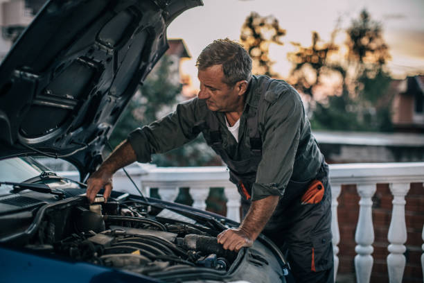 istock Mechanic repairing car 994844808