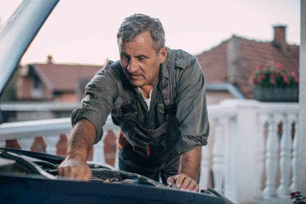istock Mechanic repairing car 994844914