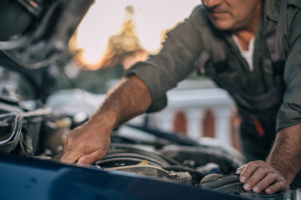 istock Mechanic repairing car 994845188