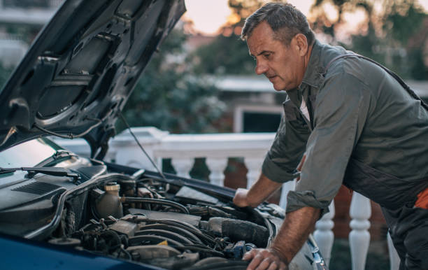 istock Mechanic repairing car 994845540