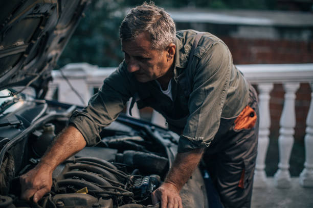 istock Mechanic repairing car 994845586