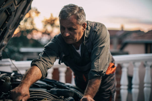 istock Mechanic repairing car 994845628