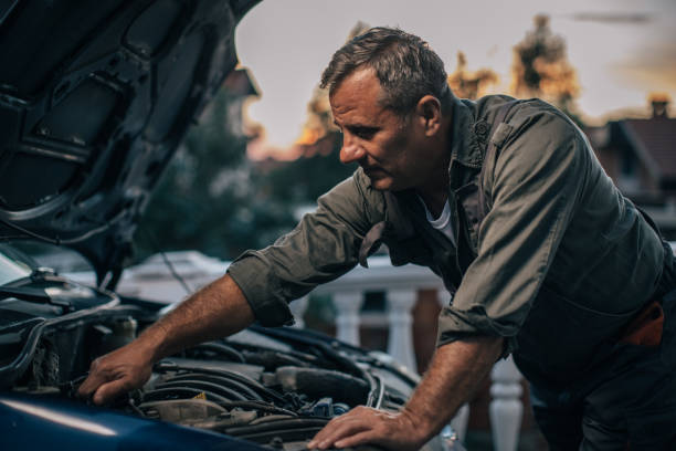 istock Mechanic repairing car 994845710
