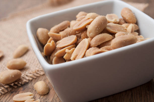 istock salted peanuts in a porcelain bowl on wooden background 994849846