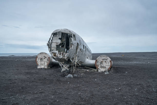 istock Airplane wreck on beach Iceland against dramatic sky, DC3 navy plane 994850686