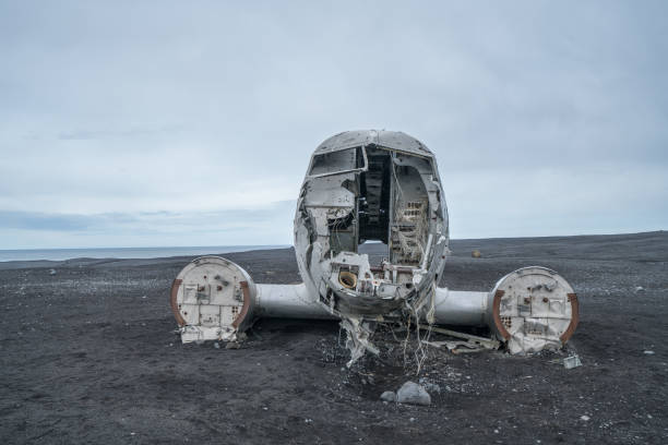 istock Airplane wreck on beach Iceland against dramatic sky, DC3 navy plane 994850746