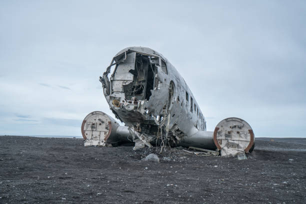 istock Airplane wreck on beach Iceland against dramatic sky, DC3 navy plane 994850816