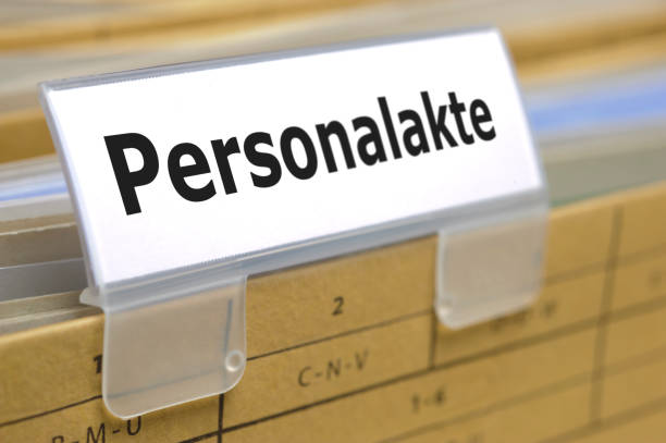 istock file folderr in office printed with personal file - in German language Personalakte 994860240
