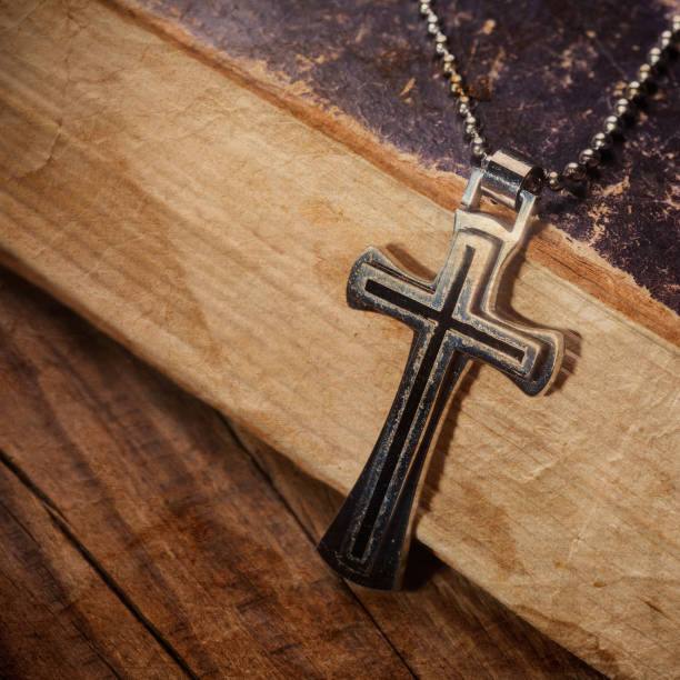 istock Closeup of silver Christian cross 994860274