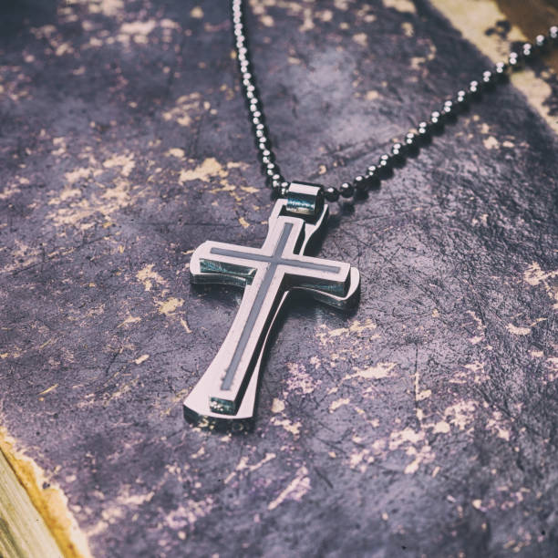 istock Closeup of silver Christian cross 994860280