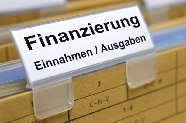 istock file folder printed with finance, receipts / expenses - in German language: Finanzierung Einnahmen / Ausgaben 994863382