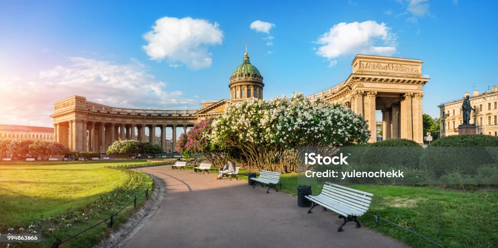 Kazan Cathedral bushes of blossoming lilacs Kazan Cathedral in St. Petersburg, lit by the morning summer sun, and bushes of blossoming lilacs St. Petersburg - Russia Stock Photo