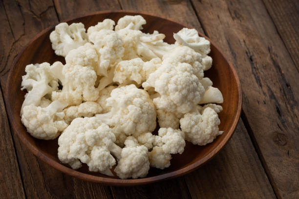 istock cauliflower on wood plate on wood 994863830