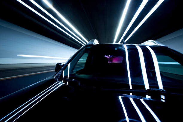 speed and motion in tunnel - lighting equipment night traffic highway imagens e fotografias de stock