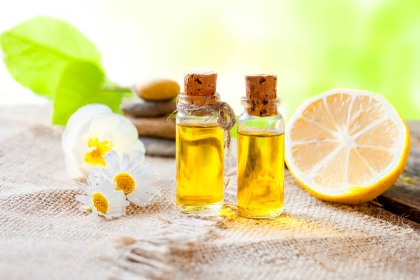 istock Essential oil of lemon on a wooden table 994869120