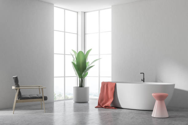 istock White tub in a white bathroom, armchair corner 994869330