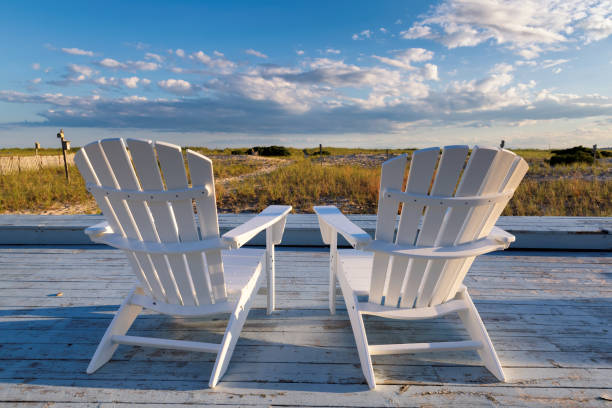 Beach chairs on Cape Cod beach Beach chairs on Cape Cod beach at sunset, Cape Cod, Massachusetts, USA. cape cod photos stock pictures, royalty-free photos & images