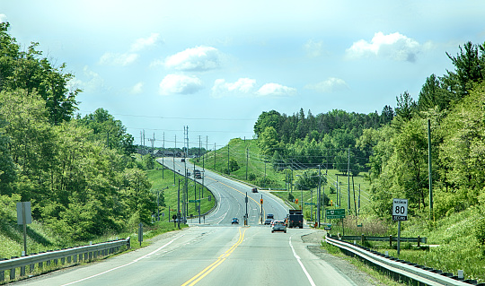 TORONTO - JUNE 8, 2018 - A road leads to the outskirts of a Newmarket city, Ontario, Canada.