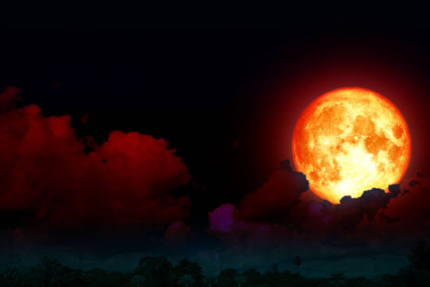 istock full strawberry moon back silhouette cloud in night sky 994890700