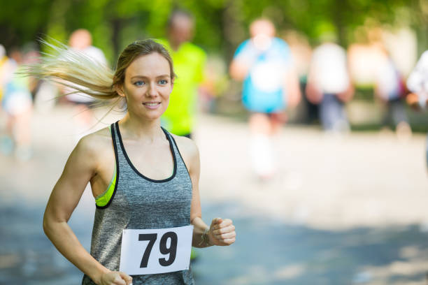 istock 27 years old woman during running event 994890822
