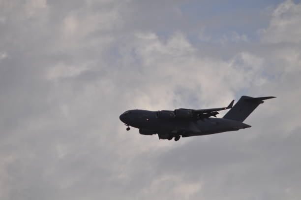 istock Military transport aircraft in flight 994891200