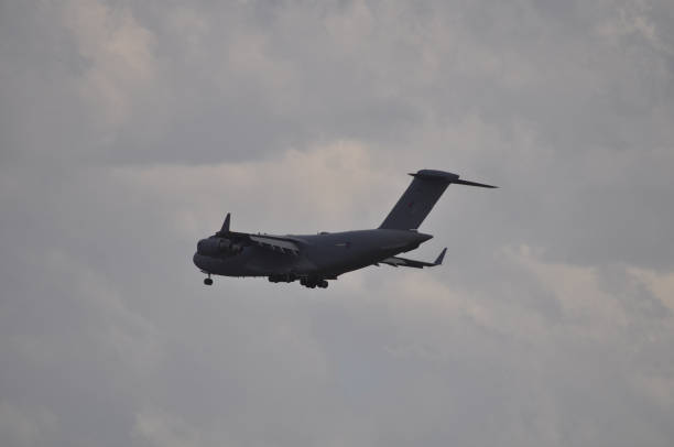 istock Military transport aircraft in flight 994891302