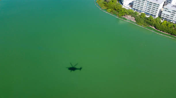Helicopter shadow flying over water, sea or lagoon, MORE OPTIONS IN MY PORTFOLIO