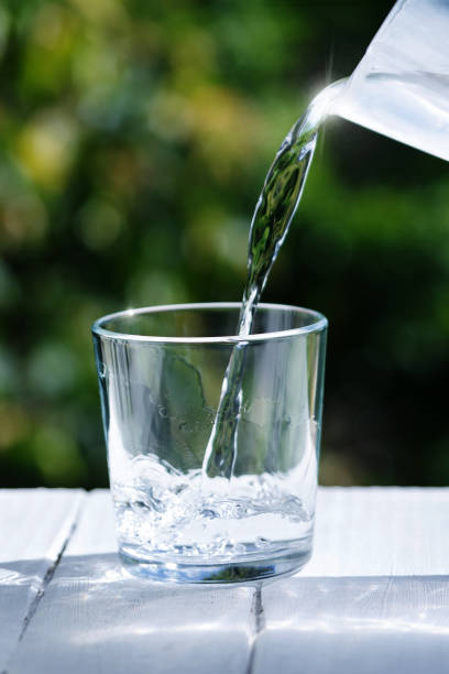istock Water is poured into a glass 994912224