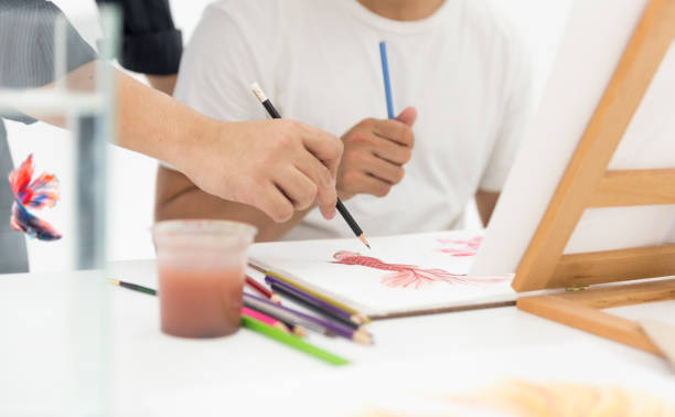 istock Learn to draw fish. Sketch, paint and coloring on paper. 994912428