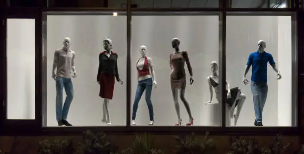 Mannequins in fashion shop, display window, interior design