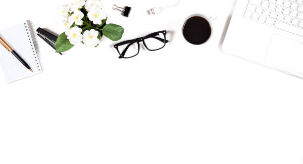 istock Office table with a computer, a notebook, glasses, pen, a stapler and a cup of coffee. 994941164