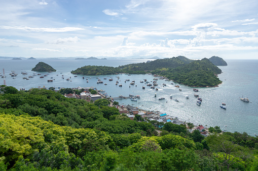 Island scene from Labuan banjo Flores in Indonesia. Island with boats at harbour.
