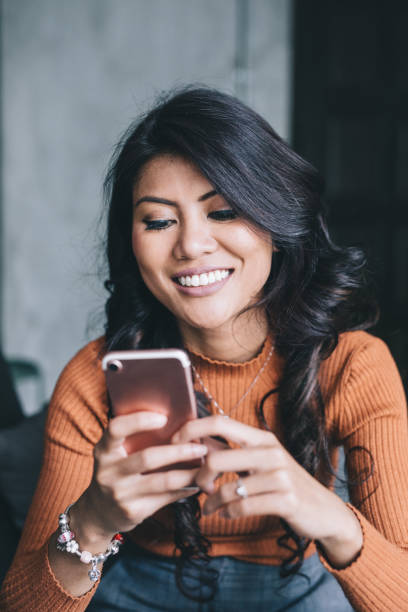 istock Portrait of woman using her smartphone. 994948072
