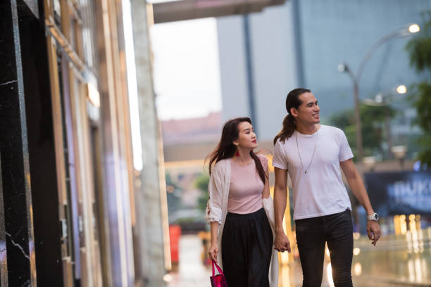 istock Couple enjoying an evening out shopping 994948516