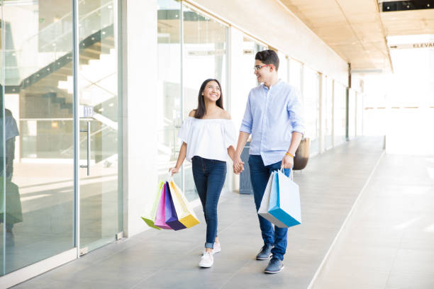 istock Lovers With Bags Spending Weekend Shopping In Mall 994954204