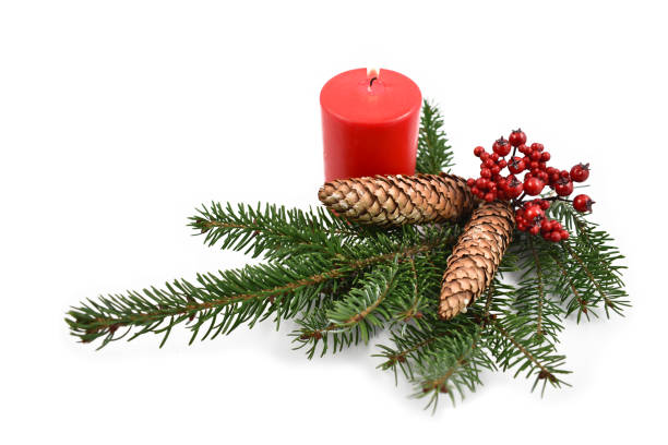 istock Spruce twig with candle stock images 994954306