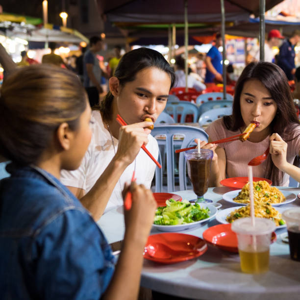 istock Friends enjoying a local night market 994977124