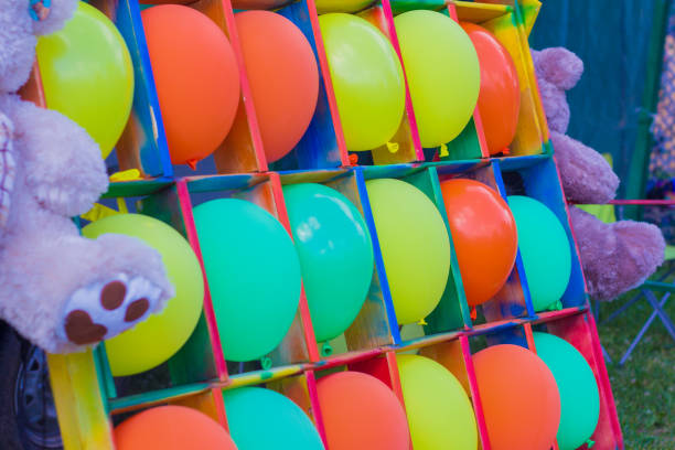 istock children's entertainment attraction with balloons and Darts 994979762