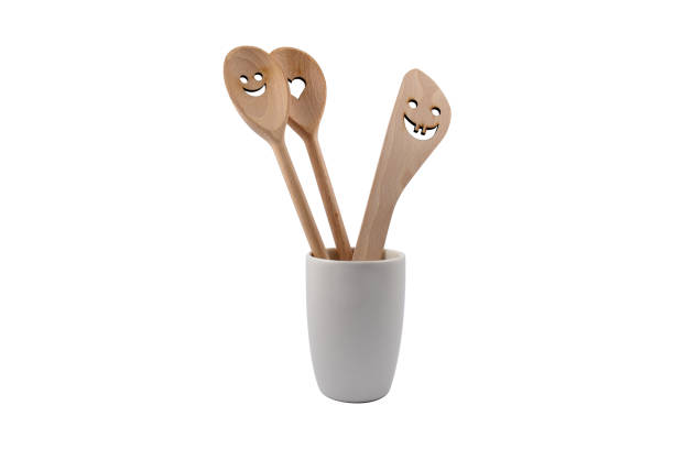 Wooden spoon on a white background. Happy wooden spoon