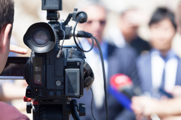 istock Filming media event with a video camera 994985140
