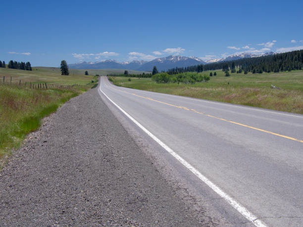 istock Highway leading to mountains in the distance 994992464
