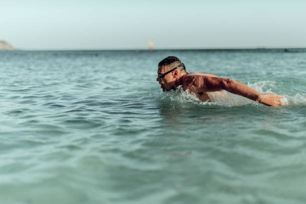 istock Man swimming on the Crete Island 995002178