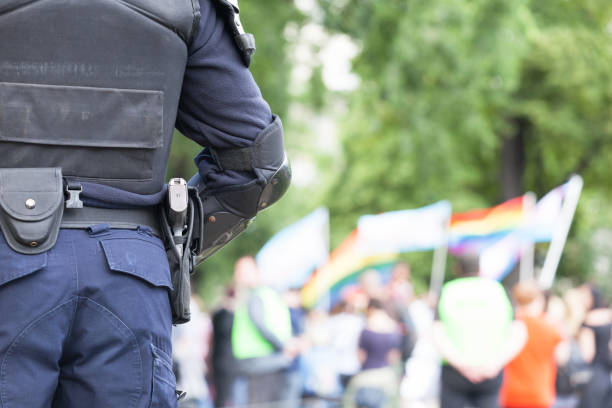 istock Policeman on duty during gay pride parade 995010670